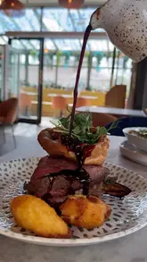 A short review video featuring a visit to Mr MacGregors, highlighting starters like chicken and prawns, followed by a Sunday roast and seabass linguine. The creator provides commentary on the quality of the food, specifically praising the tenderness of the beef and the crispiness of the roast potatoes.