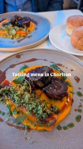 A review of a French patisserie in Chorlton, Manchester, highlighting their new 5-course tasting menu. The video features close-up shots of the dishes, including focaccia, goat's cheese croquettes, lamb breast, and lemon curd parfait, while the creator provides a voiceover detailing the menu, the chef's background, and the halal/alcohol-free nature of the offering.