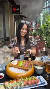 A review-style reel showcasing a meal at Sticks'n'Sushi in Battersea, highlighting the sushi, sashimi, grilled sticks, and the view of the Power Station.