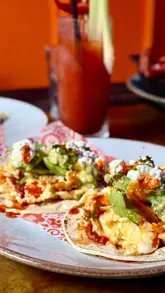 A short promotional video featuring a visit to The Basement Bar in Edinburgh for their Sunday brunch. The video highlights the interior, the menu, cocktails, and various food items including tacos, a burrito, and a dessert sundae.