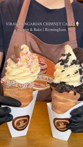 A short, visually-focused reel showcasing the preparation of Hungarian chimney cakes topped with soft-serve ice cream, brownies, and various sauces at Twist & Bake in Birmingham.