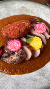 A creator visits two popular South Asian restaurants in Bristol, Nadu and Nutmeg Street Kitchen, to review their food and experience. The video features interviews with the owners, behind-the-scenes kitchen footage, and tasting segments, while also promoting an Uber Eats discount offer.