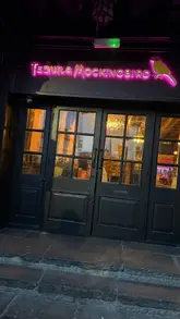 The video is a vlog-style tour of Tequila Mockingbird in St Albans, highlighting the venue's recent refurbishment. The creator guides the viewer through the bar area, showcases the cocktail menu, and demonstrates the new karaoke room, emphasizing the fun atmosphere for a night out.