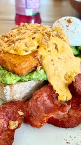 A montage showcasing a cafe located at an airfield, featuring brunch dishes like chorizo and halloumi on toast, matcha lattes, and views of planes taking off and landing.