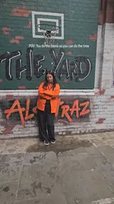 A fun, energetic reel showcasing 'The Yard at Alcotraz,' an immersive prison-themed outdoor bar experience. The video features groups of friends in orange jumpsuits engaging in activities like chess and bowling, and enjoying cocktails served in unique vessels like a shoe.