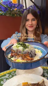 The video features a creator visiting two restaurants on Charlotte Street in London: Norma, an Italian restaurant, and its sister restaurant, Gallio, which serves Eastern Mediterranean cuisine. The reel showcases a variety of dishes, including aubergine parmigiana, bone marrow ragu, truffle arancini, and chicken shawarma, while highlighting the outdoor terrace and overall dining experience.
