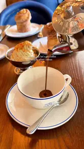 The video features a series of close-up, slow-motion shots of cruffins and hot chocolate being prepared and served at Richoux. It highlights the texture of the pastries and the indulgent nature of the hot chocolate, creating a strong visual appeal for a cafe/brasserie setting.