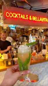 A fast-paced, engaging review of an Italian restaurant in Leeds called Livin' Italy, showcasing cocktail preparation, pizza and pasta dishes, and the venue's cozy atmosphere.