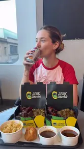 A creator visits Jerk Junction in Trinity Kitchen, Leeds, to review their 'Big Tings' meal deal. The video features the creator talking about the food options, including jerk chicken, peppered steak, goat curry, mac and cheese, and dumplings, while providing a taste test and recommendation.