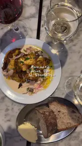 A montage showcasing the interior, wine selection, and small plates at Clara's, a cozy wine bar and bistro in Shoreditch.