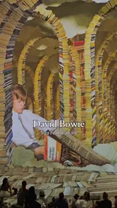 The video provides a tour of the David Bowie: You're Not Alone immersive exhibition at Lightroom, London. It features clips of the large-scale projections, archive footage, and the overall atmosphere of the space, accompanied by a voiceover explaining the experience.