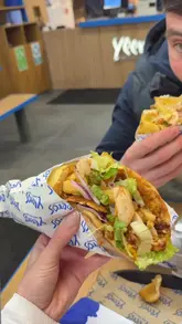 A vlog-style review of a Greek street food venue called Yeeros, where the creator shares her honest, somewhat lukewarm opinion on the food.