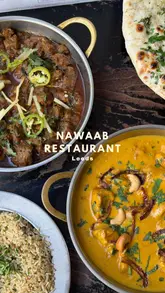 A creator visits Nawaab in Leeds, showcasing a variety of South Asian dishes including lamb chops, curries, naan, and a pineapple dessert, while highlighting the restaurant's atmosphere and menu.