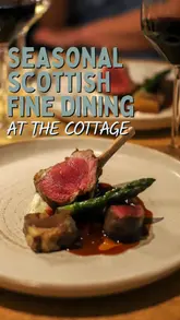 A creator visits 'The Cottage' in Edinburgh, providing a detailed review of their nine-course tasting menu. The video features shots of the restaurant's exterior and interior, the open kitchen, and close-ups of the various dishes served, accompanied by an enthusiastic voiceover.