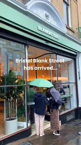 A promotional video for the opening of a new Blank Street coffee shop in Bristol. The video features shots of the shop's interior, staff preparing drinks, and a close-up of a flight of various matcha beverages being poured.
