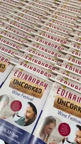 A montage video showcasing the Edinburgh Uncorked wine festival held at the Assembly Rooms. The video features shots of the venue, various wine bottles, wine being poured, and attendees participating in a masterclass.