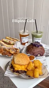 A short, punchy montage showcasing various food and drink items from a Filipino cafe, including sandwiches, pastries, and lattes. The video focuses on close-up shots of the food to highlight textures and presentation.