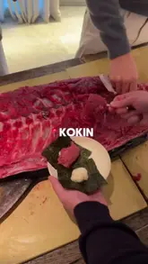 The video documents a 'Tuna Samurai Night' at Kokin in London, featuring a live bluefin tuna butchery demonstration followed by a multi-course tasting menu. The creator captures the unique experience of scraping fresh tuna from the bone, alongside various dishes like sashimi, ramen, and grilled tuna collar.