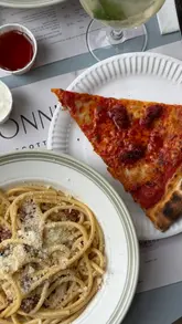 A creator visits Flur, a new New York-style pizza and pasta bar located within the Bonnie & Wild marketplace in Edinburgh. The video features the creator reviewing various dishes, including pizza slices and pasta, while highlighting the open kitchen concept and the overall dining experience.