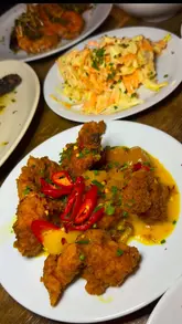 A review of the sharing set menu at Turtle Bay, highlighting the variety of Caribbean dishes, unlimited sides, and cocktail deals.