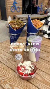 A short montage showcasing loaded fries, specialty drinks, and desserts at The Ferry View in South Shields, highlighting the outdoor seating area and customizable food options.