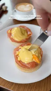 A short, aesthetic montage showcasing breakfast dishes like Eggs Royale and truffle scrambled eggs, alongside a coffee and the restaurant's interior.