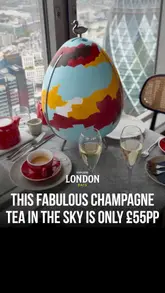 A review of the afternoon tea experience at Duck & Waffle, featuring the unique egg-shaped stand, panoramic views of London, and a glass of Veuve Clicquot. The creator highlights the value for money and specific savoury items.