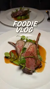The video documents a foodie weekend getaway in the English countryside, featuring a stay at a pub hotel, a Michelin-star dining experience, and a visit to a shopping village. It combines personal vlog-style commentary with shots of the accommodation, scenic surroundings, and various meals, including a Sunday roast and a tasting menu.