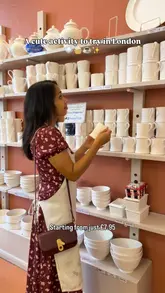 A short, aesthetic reel showcasing a pottery painting experience at a cafe in London, featuring shots of the pottery selection, the painting process, and the cafe's coffee and cake offerings.