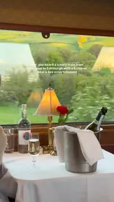 A montage video showcasing a luxury train journey from Liverpool to Edinburgh, featuring the vintage carriage interiors, live musical entertainment, scenic views, and a multi-course dining experience.