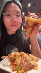 A creator visits Cluk in Manchester, highlighting the venue's location on Canal Street, the interior atmosphere, and various menu items including kimchi jeon, fried chicken, and curry. The video also promotes specific deals like bottomless wings and happy hour offers.