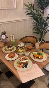 A montage showcasing various brunch dishes, pastries, and coffee at Touché cafe, highlighting the aesthetic interior and food presentation.