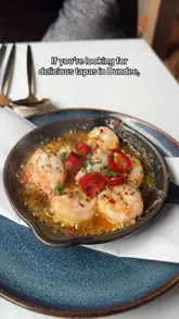 Here are a few options for your alt text, keeping it descriptive and SEO-friendly:

**Option 1 (Best for general SEO):**
Delicious selection of tapas dishes including prawns and halloumi served at The Selkie restaurant in Dundee.

**Option 2 (Focusing on the experience):**
Table spread of gourmet tapas dishes at The Selkie, a highly-rated restaurant in Dundee city centre.

**Option 3 (Concise):**
Close-up of various tapas plates, including chorizo and prawns, at The Selkie restaurant in Dundee.

**SEO Tip:** I included the restaurant name ("The Selkie") and the location ("Dundee") in all options, as these are the most important keywords for local search discoverability.