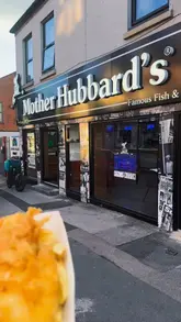 A promotional video for Mother Hubbard's in Kings Heath, Birmingham, highlighting their 'Buy One Get One Free' daily deals. The creator showcases various menu items including fish and chips, fish bites, a salt and pepper box, loaded fries, and burgers, while explaining the specific offers available throughout the week.