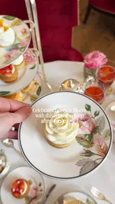 A high-quality, aesthetic montage showcasing a limited-edition floral-themed afternoon tea service at Brown's Hotel in London. The video features close-ups of delicate pastries, finger sandwiches, and tea service, set within the elegant Drawing Room.