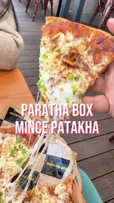 A food review video featuring a visit to Paratha Box in Glasgow, where the creator tries the new Mince Patakha Paratha Pizza, along with other items like a breakfast wrap and curly fries.
