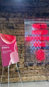 The creator documents her experience attending a Barry's Bootcamp class in Manchester while testing a new cream blush product to see if it survives an intense workout. The video takes the viewer through the entrance, the studio, the workout itself, and the changing room facilities, providing a comprehensive look at the venue and the experience.