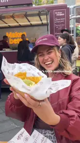 A promotional video capturing the Cathedral City 60th anniversary roadshow, featuring various cheese-based street food dishes like jacket potatoes, toasties, and nachos, alongside event activities like a photo booth.