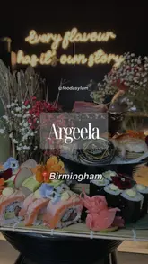 A high-quality, fast-paced montage showcasing the new sushi counter at Argeela. The video features close-up shots of sushi preparation, flaming cocktails, and a variety of plated dishes and desserts, emphasizing the premium presentation and atmosphere of the venue.