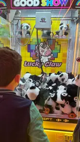 A family-focused reel showcasing 'Lucky Claw' in Birmingham, featuring children playing on various claw machines and a light-up floor game. The video highlights the ease of winning prizes and the fun atmosphere of the arcade.
