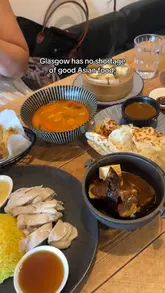 A review of Satu Satu, a Malaysian restaurant in Glasgow, showcasing various dishes like Hainanese chicken rice, tofu and aubergine with satay sauce, Tom Yum prawn soup, crispy chicken wings, roti canai, and pork sui mai.