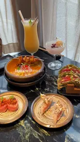 A polished food review of Fan in Notting Hill, showcasing their Japanese-Peruvian fusion menu including ceviche, tuna tacos, and various nigiri dishes.