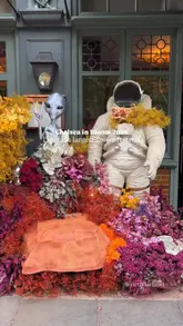 A montage video showcasing various floral art installations at the Chelsea in Bloom festival in London, themed 'Out of This World'.
