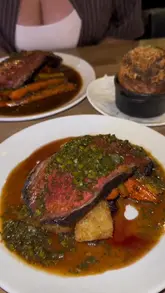 A review of a Sunday roast at Lennox restaurant in Manchester. The video features the preparation of the meal, including fire-cooked treacle striploin, smoked jalapeno and apple oysters, and a sharing tiramisu. The creator provides a voiceover review, highlighting the quality of the ingredients and the cooking techniques.