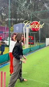 A vlog-style video documenting a hospitality experience at a women's cricket match at Sophia Gardens. The creator showcases the 'Captain's Clubhouse' hospitality area, including the food, drinks, and the match atmosphere, while also participating in activities like hair tinsel and cricket cages.