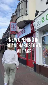 A promotional video for a new Berto's takeaway location in Blanchardstown, featuring a tour of the shop, a look at the food preparation, and a taste test of various menu items including pizza, pasta, and milkshakes.