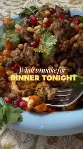 A home cooking tutorial demonstrating how to make crispy lamb bowls with hummus, roasted vegetables, and feta. The creator guides the viewer through the preparation and assembly of the dish in a clear, step-by-step format.