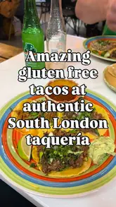 A short review video of a Mexican taqueria located inside a market in South London. The video features shots of the exterior, the menu/signage, and close-ups of the tacos and drinks, accompanied by a voiceover explaining the owner's story and the gluten-free options.