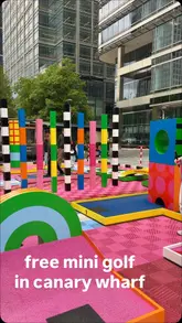 A short, energetic vlog showcasing a free, pop-up mini-golf course in Canary Wharf, highlighting the accessibility and fun nature of the activity.