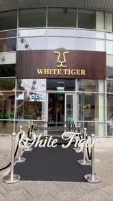 A promotional reel for the launch of White Tiger in Liverpool, featuring shots of the venue's interior, live music, and a variety of canapés and drinks.